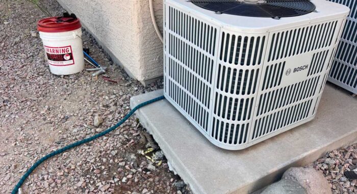 Thirsty Rattlesnake Under an AC Unit